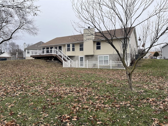 back of property with a wooden deck