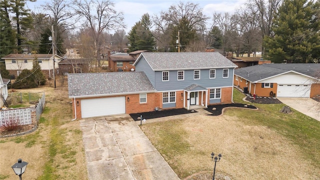 view of front of home with a garage and a front lawn