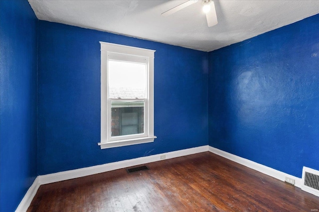 empty room with wood-type flooring and ceiling fan