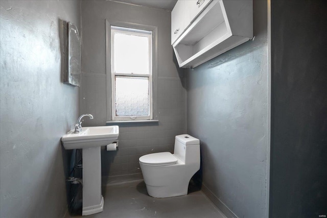 bathroom with toilet and sink