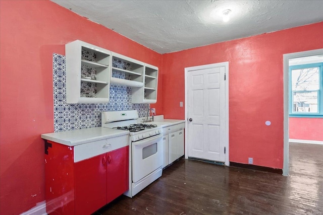 kitchen featuring white gas range, dark wood-type flooring, sink, and a textured ceiling