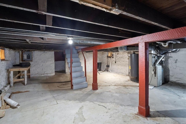 basement featuring water heater, heating unit, and electric panel