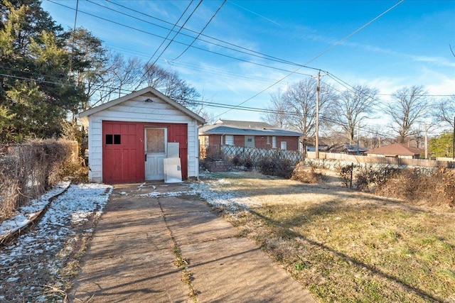 back of property with a storage unit and a lawn