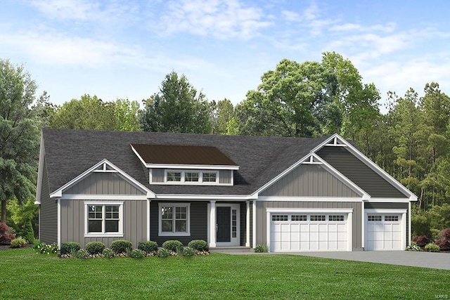 view of front of house with a garage and a front lawn