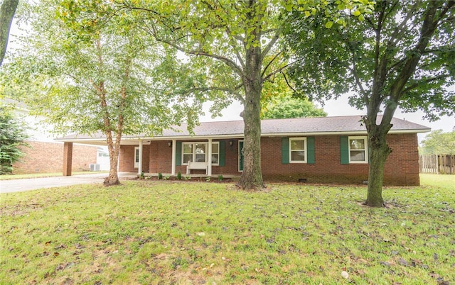 single story home with a carport and a front lawn