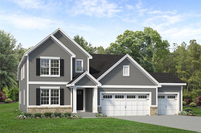 view of front of property featuring a garage and a front yard