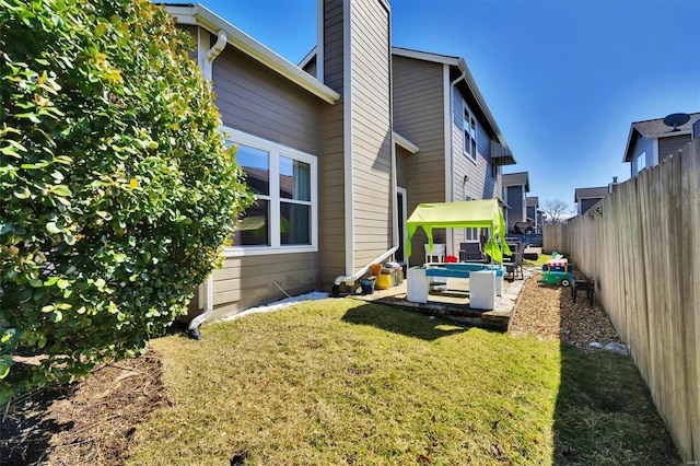 view of yard with a patio area and a fenced backyard