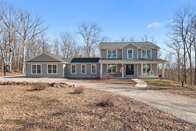 view of front facade with covered porch and driveway