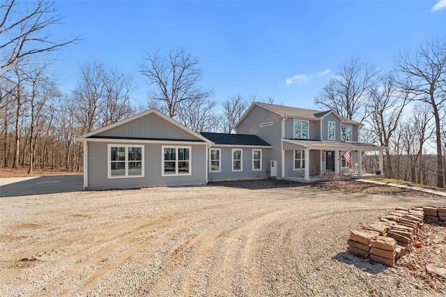 view of front of property with a porch and driveway