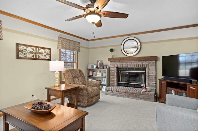 carpeted living room featuring crown molding, a brick fireplace, and a ceiling fan