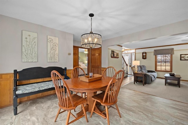 dining space featuring an inviting chandelier