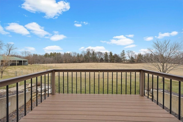 wooden deck with a lawn