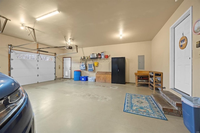 garage featuring electric panel and a garage door opener