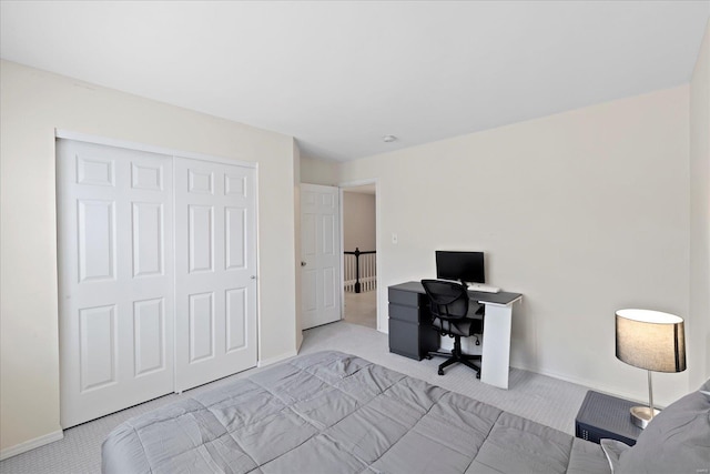 bedroom featuring carpet floors, a closet, and baseboards