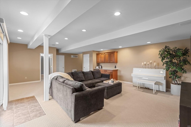 living room with light colored carpet, recessed lighting, visible vents, and baseboards