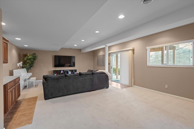 living area featuring recessed lighting, light carpet, and baseboards