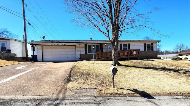 single story home featuring a garage, covered porch, and driveway