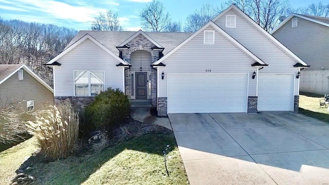 view of front facade with a garage, concrete driveway, and brick siding