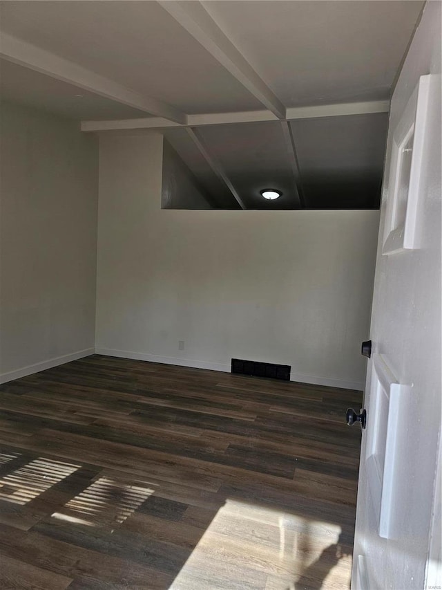 empty room featuring dark wood-type flooring