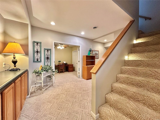 interior space featuring carpet floors, recessed lighting, visible vents, and baseboards