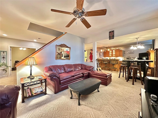 living area with light carpet, a ceiling fan, and recessed lighting