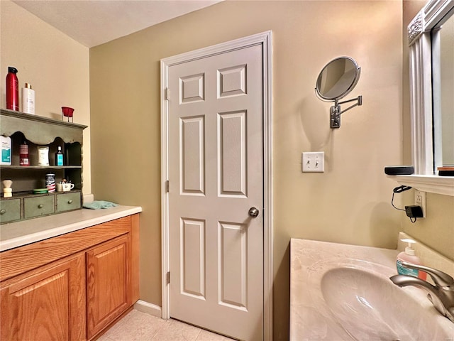 bathroom featuring a sink and tile patterned floors