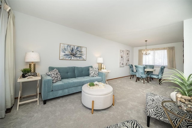 living room with a notable chandelier and carpet