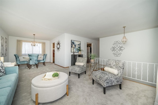 living room with an inviting chandelier and carpet floors