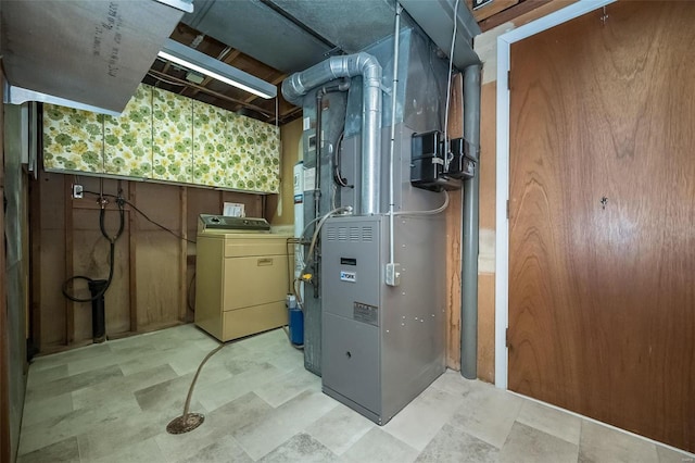 utilities featuring heating unit and washer / dryer