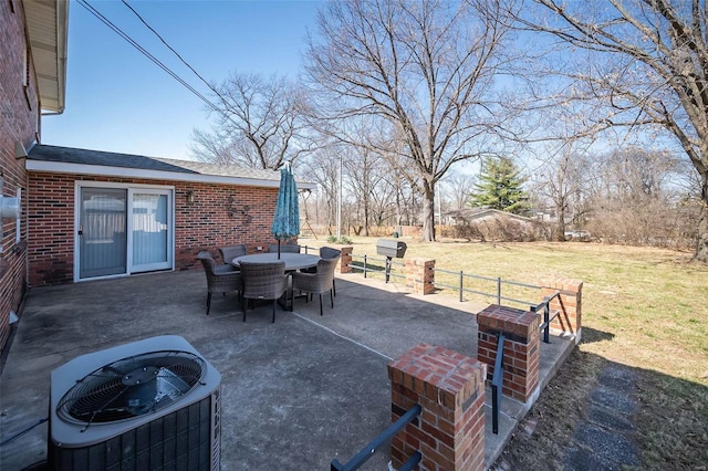 view of patio / terrace with outdoor dining space and central AC unit