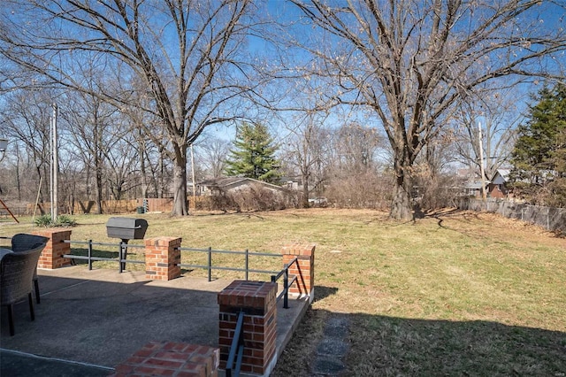 view of yard featuring a patio and fence