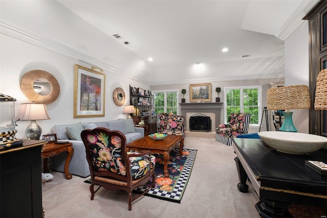 living area featuring recessed lighting, visible vents, a fireplace with raised hearth, ornamental molding, and light carpet