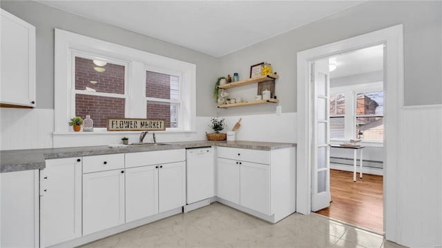 kitchen with marble finish floor, white dishwasher, and white cabinets