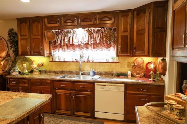 kitchen with tasteful backsplash, sink, and dishwasher