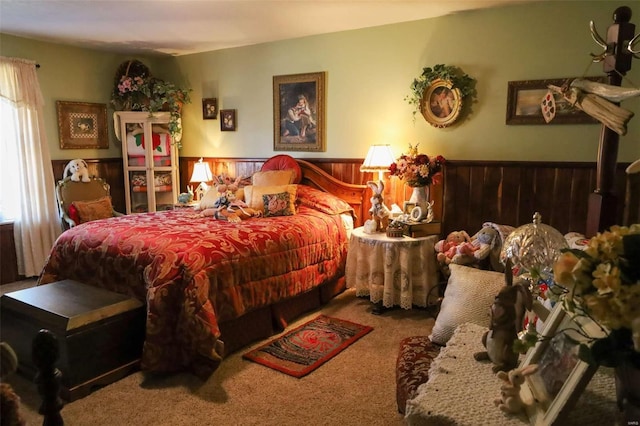 carpeted bedroom with wooden walls