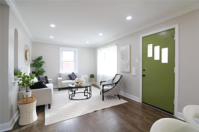 living area with dark wood-style floors, baseboards, recessed lighting, arched walkways, and crown molding