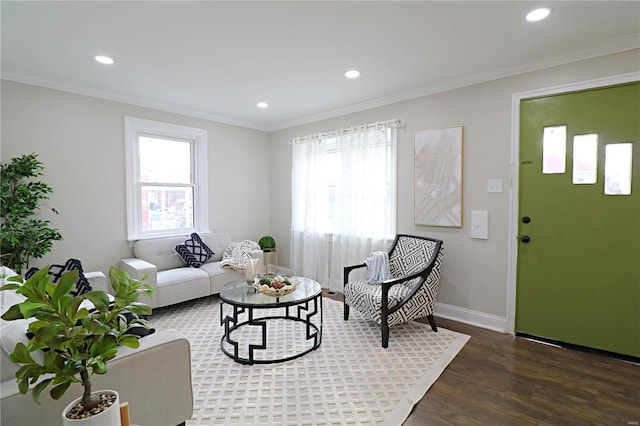 living area with recessed lighting, crown molding, baseboards, and wood finished floors