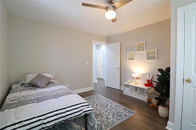 bedroom with baseboards, wood finished floors, and a ceiling fan