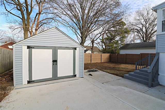 view of shed with a fenced backyard