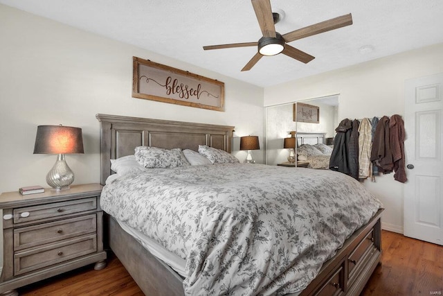 bedroom featuring dark wood-type flooring and ceiling fan