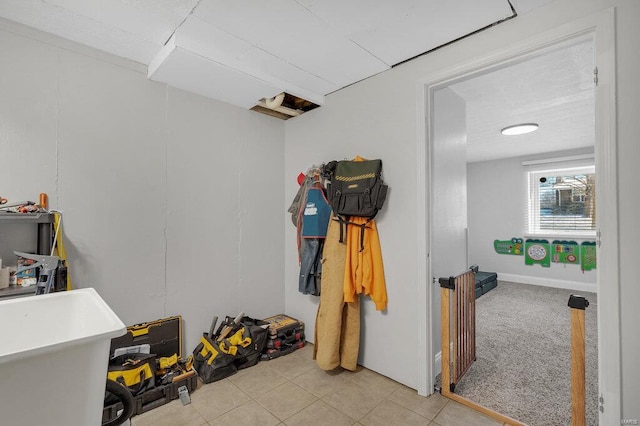 interior space featuring light tile patterned floors