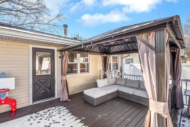 wooden terrace featuring outdoor lounge area