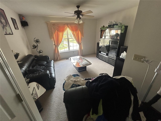 living room featuring carpet and ceiling fan