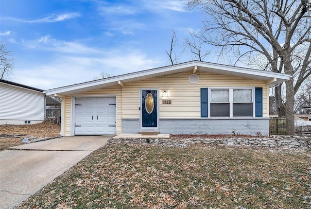 view of front of property with concrete driveway and brick siding