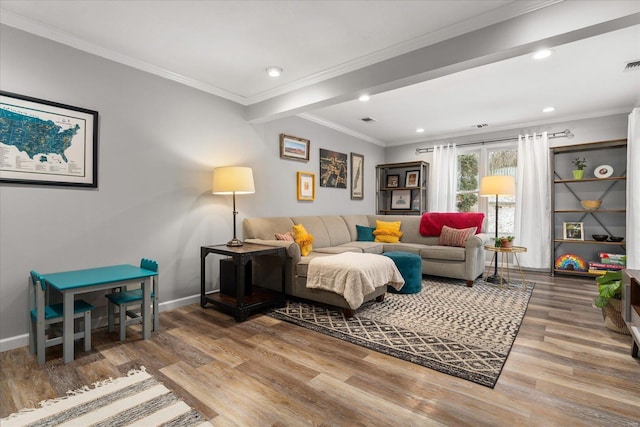 living room with ornamental molding and hardwood / wood-style floors