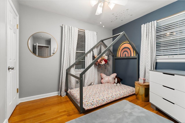 bedroom featuring ceiling fan and wood-type flooring