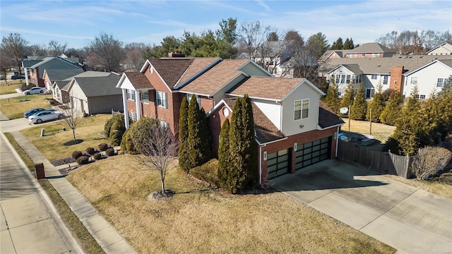 view of front facade featuring a garage and a front yard