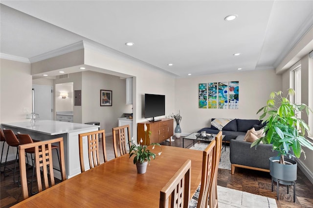 dining space featuring ornamental molding, recessed lighting, and baseboards