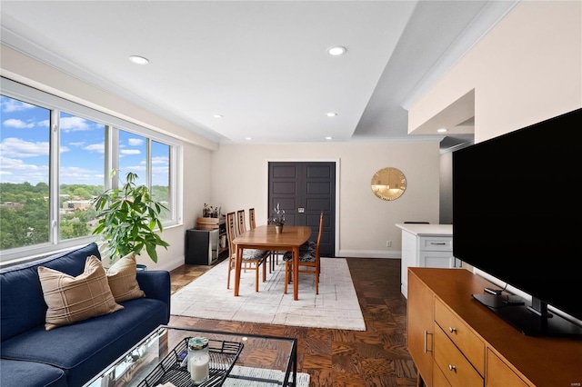 living room with recessed lighting and baseboards