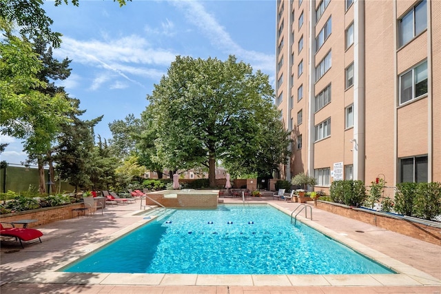 pool with a patio area